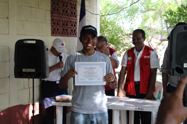 Miguel receiving an ISLA certificate.