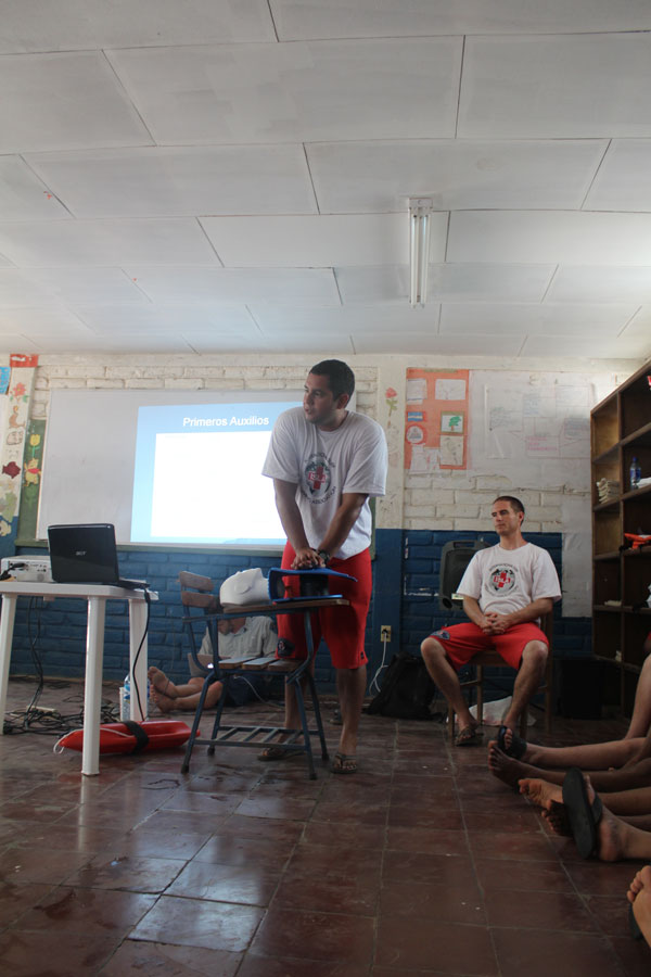 Henry running the hands-on CPR training course during a classroom lecture