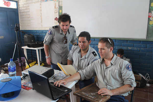 Henry preps Olin and Scott for the training course exams